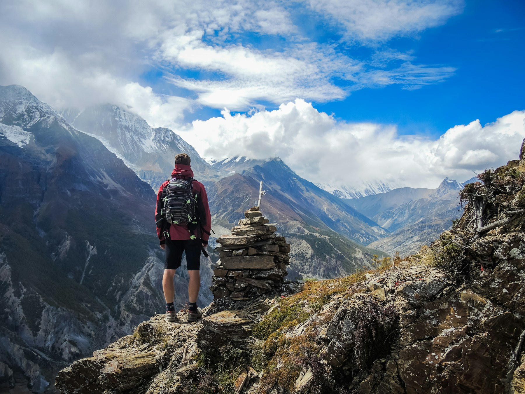 Traveller looking across a mountain landscape