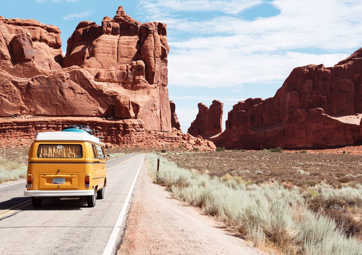 Camper van travelling through a scenic landscape