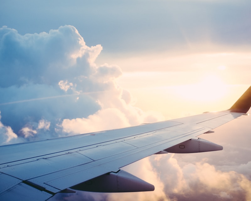 Airplane wing above the clouds